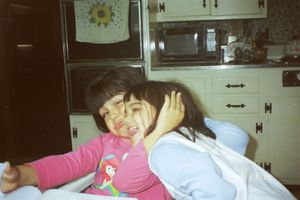 Series of candid photos showing joyful moments in a kitchen setting.
