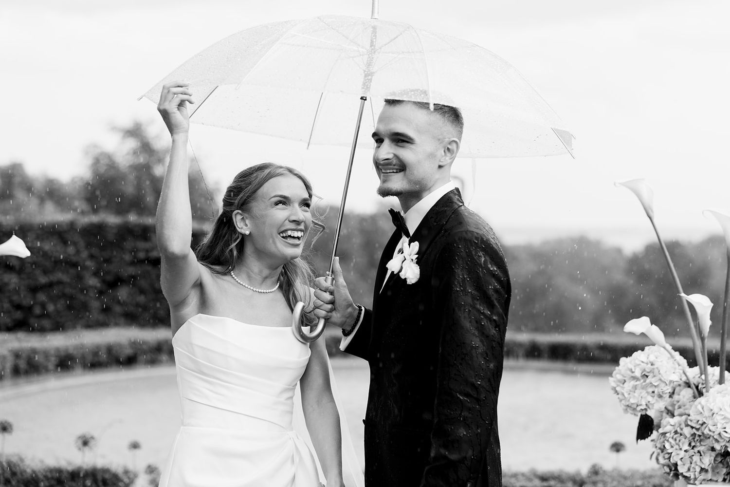 Black and white wedding photos showing joyful moments between a couple in formal attire during their celebration.