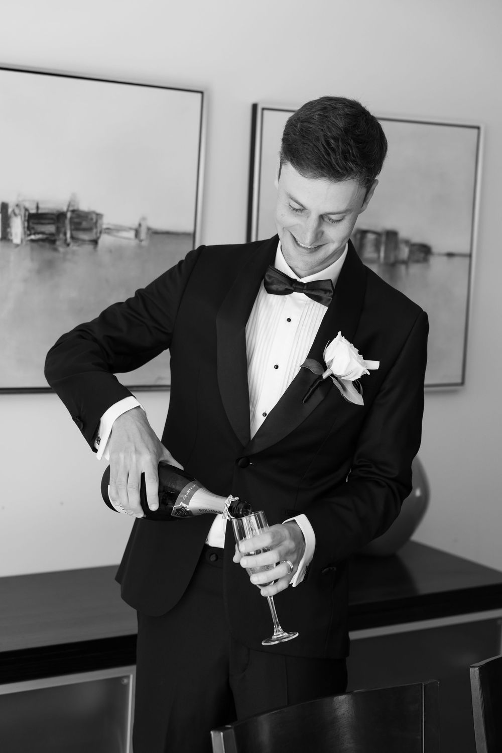 A sequence of black and white photos showing someone in a tuxedo pouring and examining a glass of champagne.