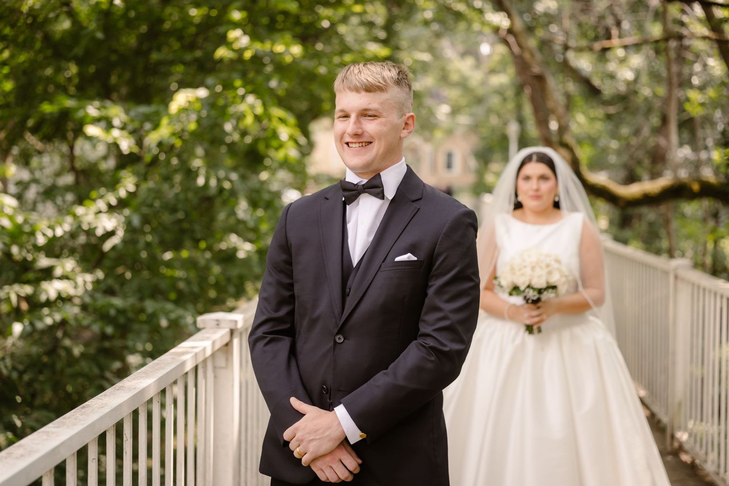 A series of outdoor wedding photos showing a couple in formal attire posing on a wooden deck surrounded by greenery.