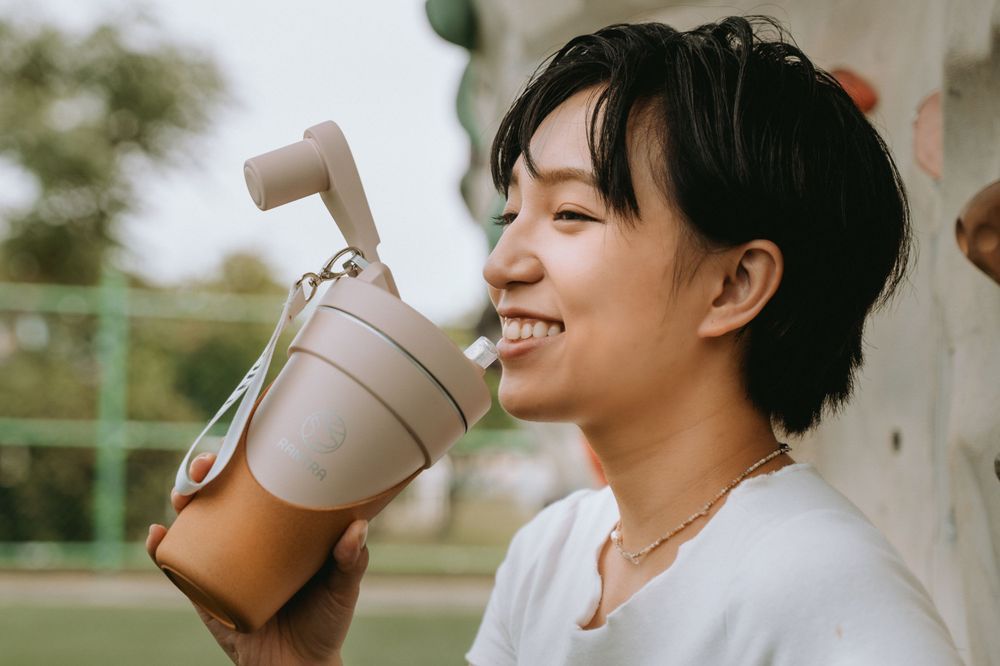 A person wearing a brown sweater drinks from a white ceramic mug in a series of candid photos.