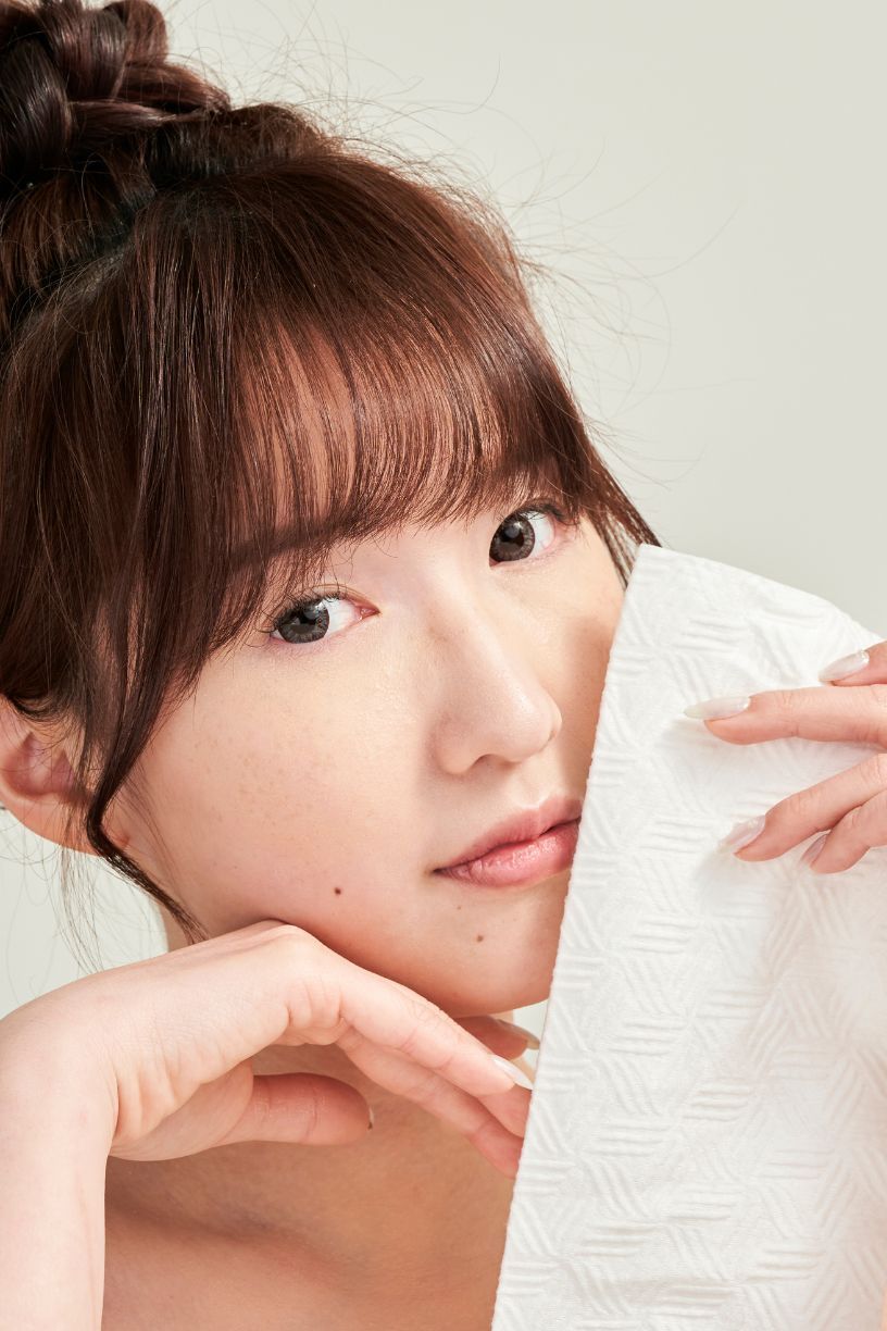 A series of close-up selfie photos showing brown hair with bangs and natural makeup in various soft poses.