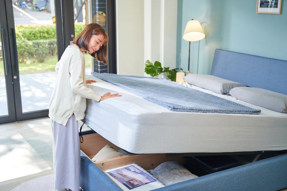 A series of photos showing someone testing different mattresses in a modern furniture showroom.