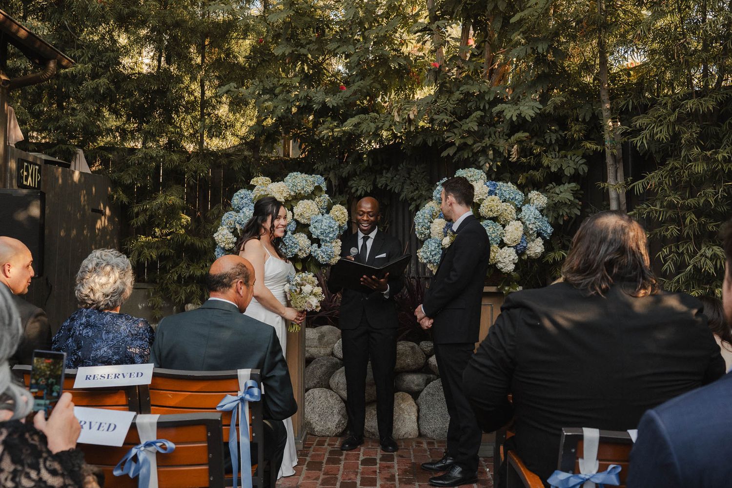 Bride and groom with family at their outdoor wedding in Pasadena