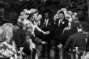 Emotional black and white shot of the couple embracing after the ceremony