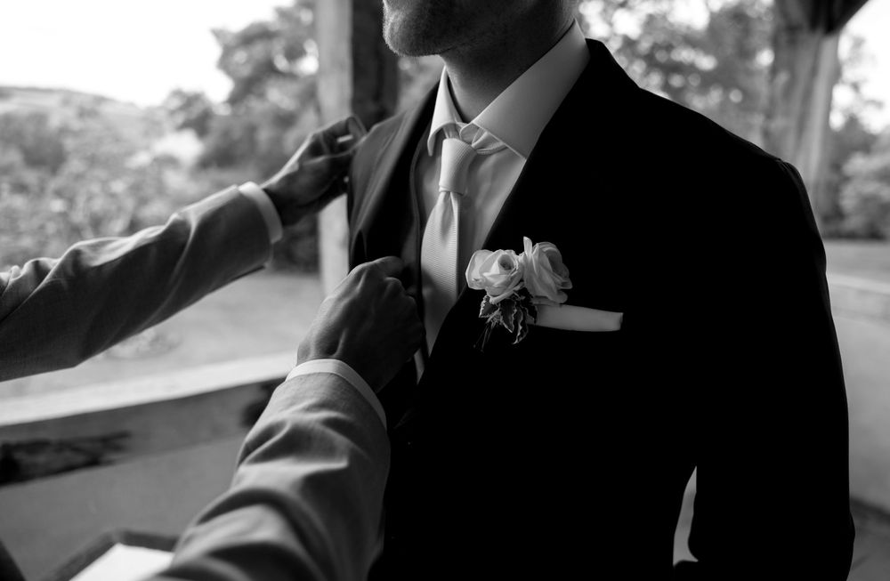 Silhouette of formal attire against bright background.