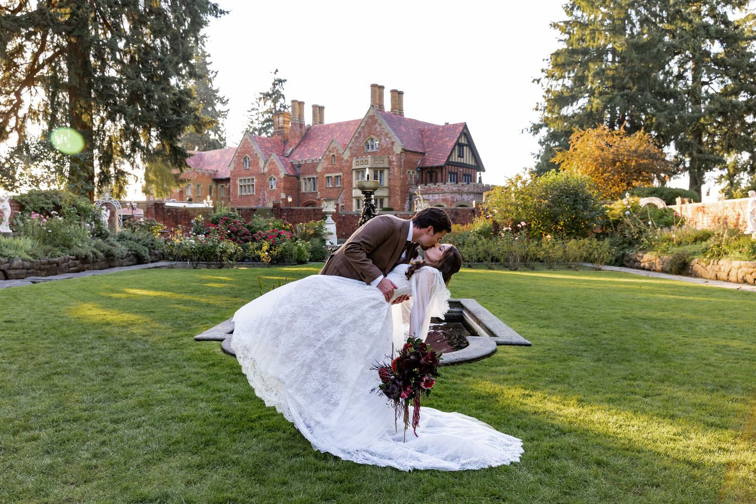 Bride and Groom Dipping in front of Thornewood castle after their Wedding Ceremony in  Lakewood Washington, PNW Wedding Photographer.