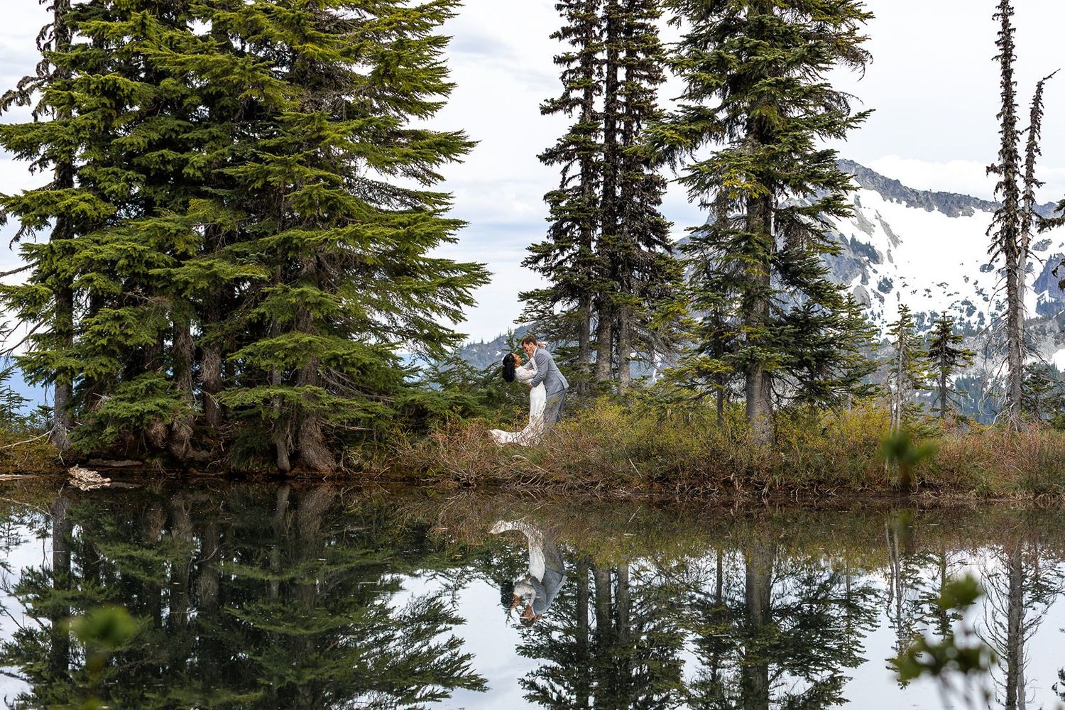 Bride and Groom Dipping in front of Thornewood castle after their Wedding Ceremony in  Lakewood Washington, PNW Wedding Photographer.