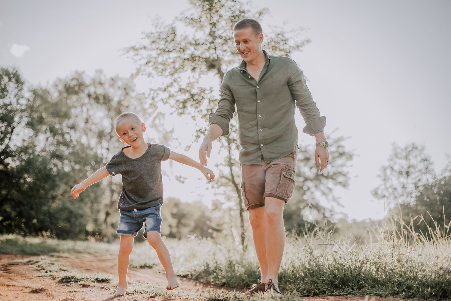 A series of candid outdoor family photos showing playful moments and interactions in a natural setting at sunset.