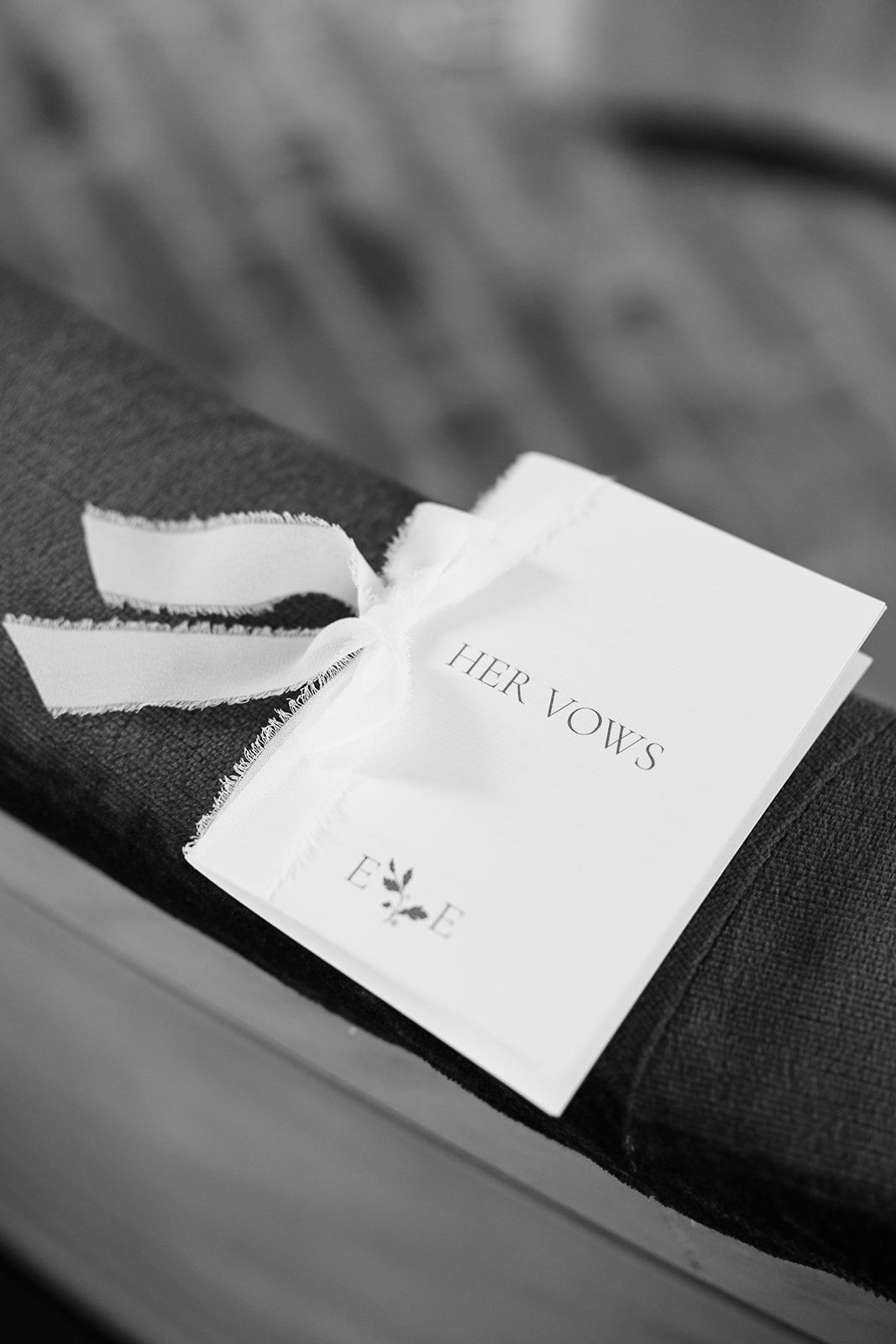 A torn white paper slip with text fragments shown in a sequence of black and white close-up photographs.
