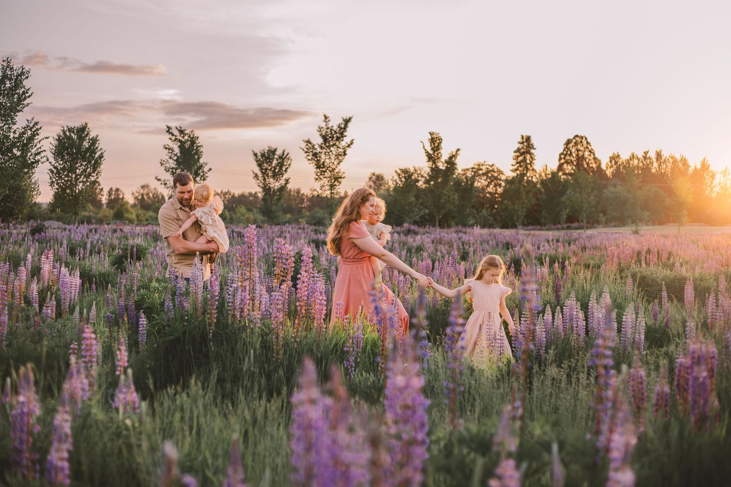 Family walking in Lupine Wildflower field during photography session in Tacoma Washington Spring family photographer