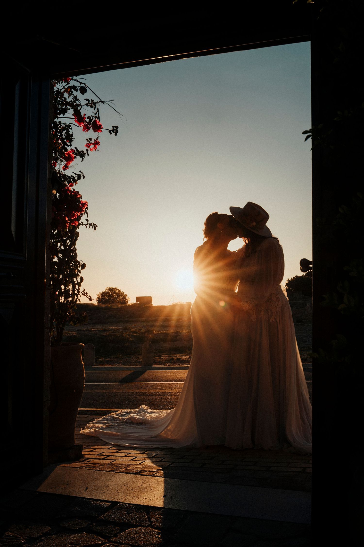 A romantic wedding dance under a canopy of string lights with sparkler fountains glowing in the background.