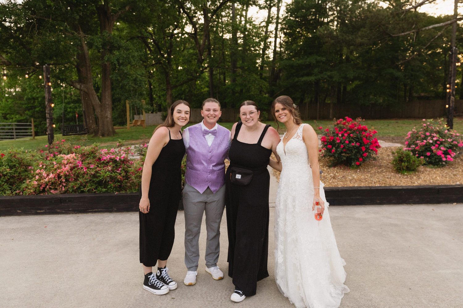 Sydney and her second shooter, Kati pose together with an LGBTQ+ newly eloped couple in Denver Colorado