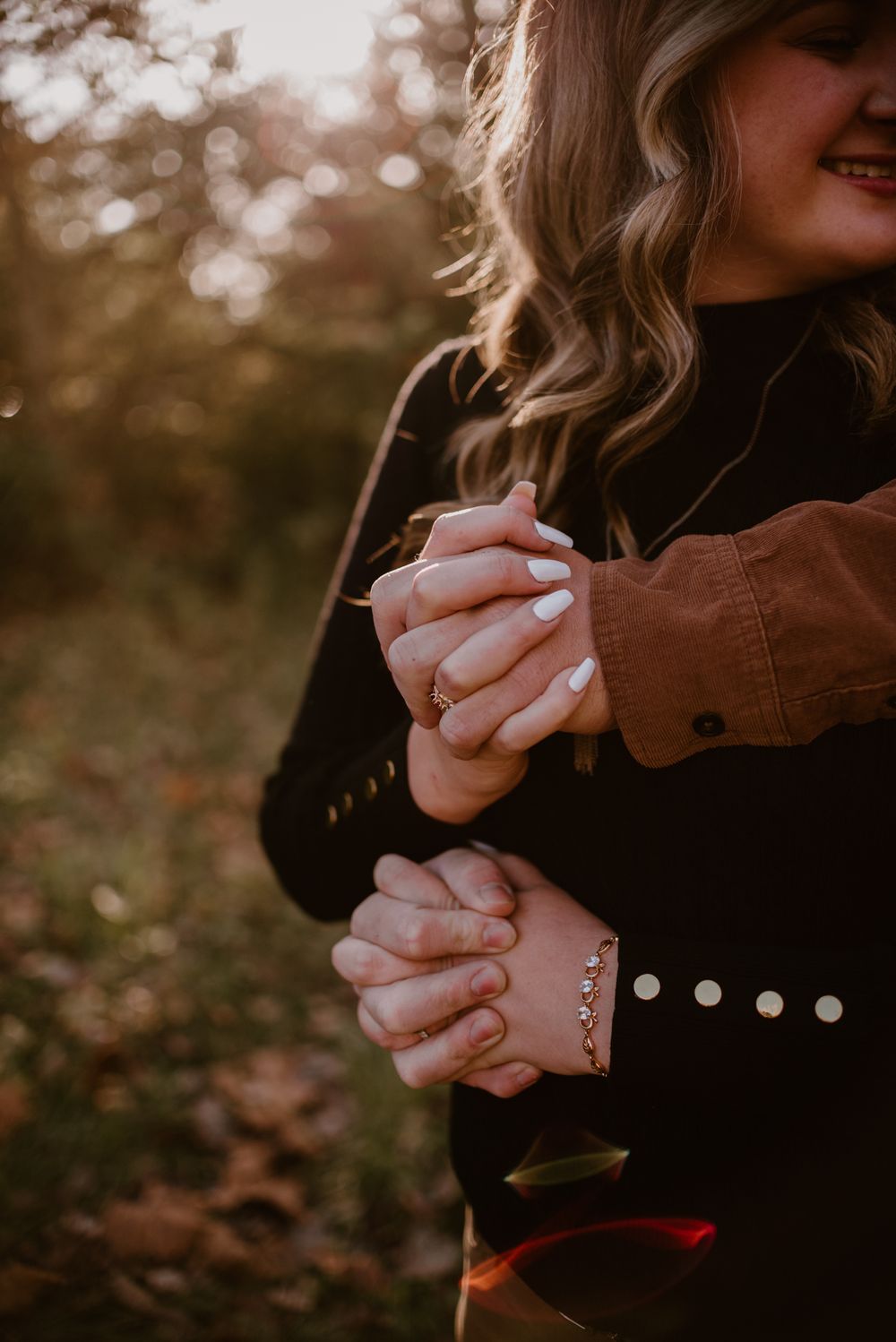 Artistic close-up shots of hands holding and interacting in warm autumn lighting.