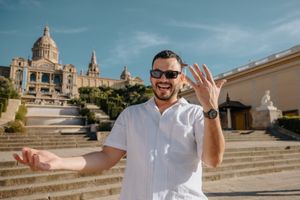 Same-sex couple smiling after surprise proposal in Montjuïc