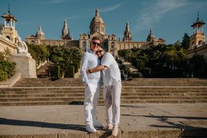 Same-sex couple smiling after surprise proposal in Montjuïc