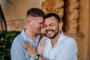 LGBTQ+ couple proposal with skyline backdrop in Montjuïc