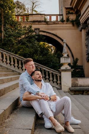 ame-sex couple surprise proposal at Montjuïc with panoramic skyline backdrop