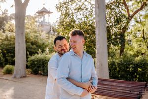 Same-sex couple holding engagement ring in Montjuïc Park
