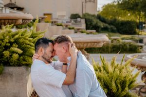 Same-sex couple engagement shoot in lush Montjuïc gardens