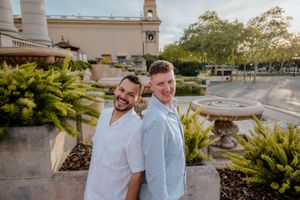 Emotional engagement moment for gay couple in Montjuïc, Sp