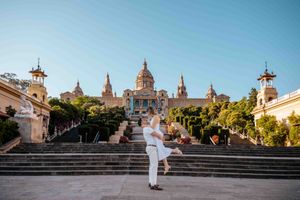 Couple embracing with city views from Montjuïc