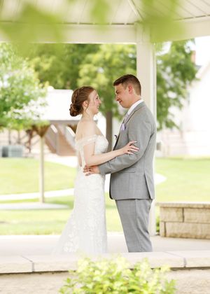 A couple shares their first look moment in a series of romantic outdoor wedding photos.