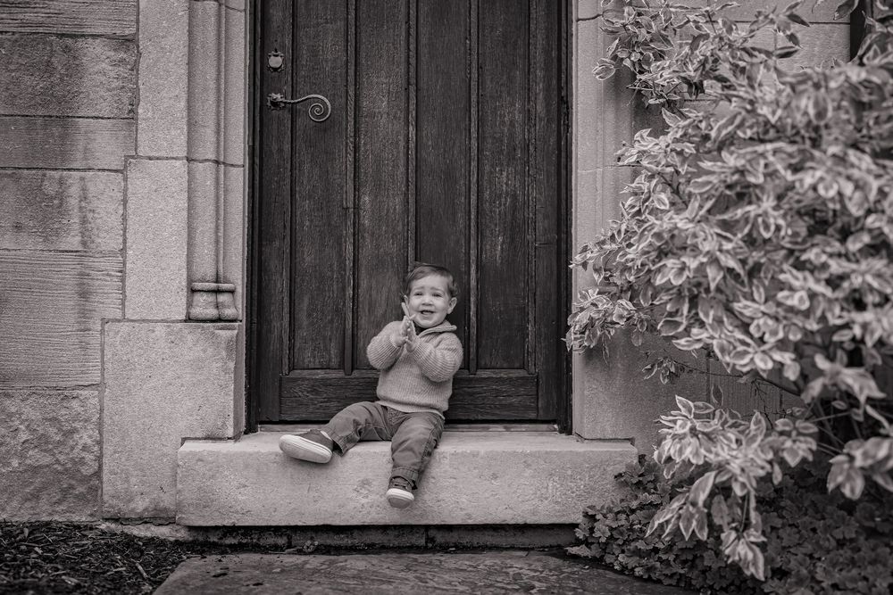 Child smiling in natural light with soft warm colors and a joyful expression.