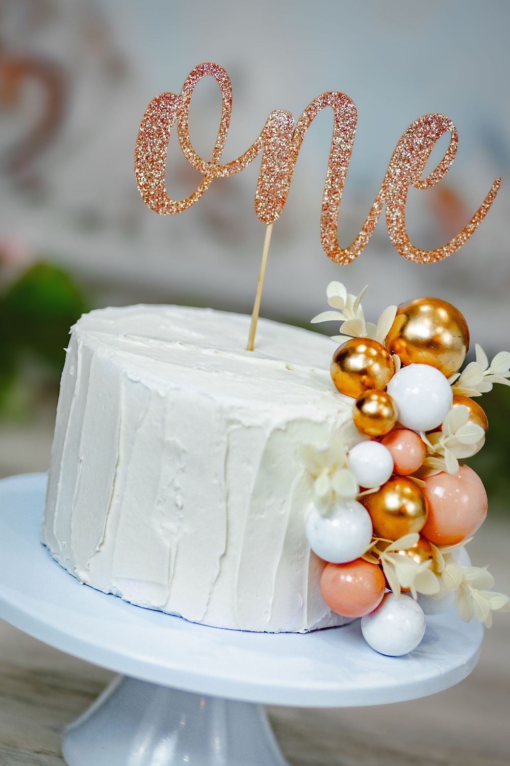 Cake, color, and cuteness overload — the perfect first birthday milestone session