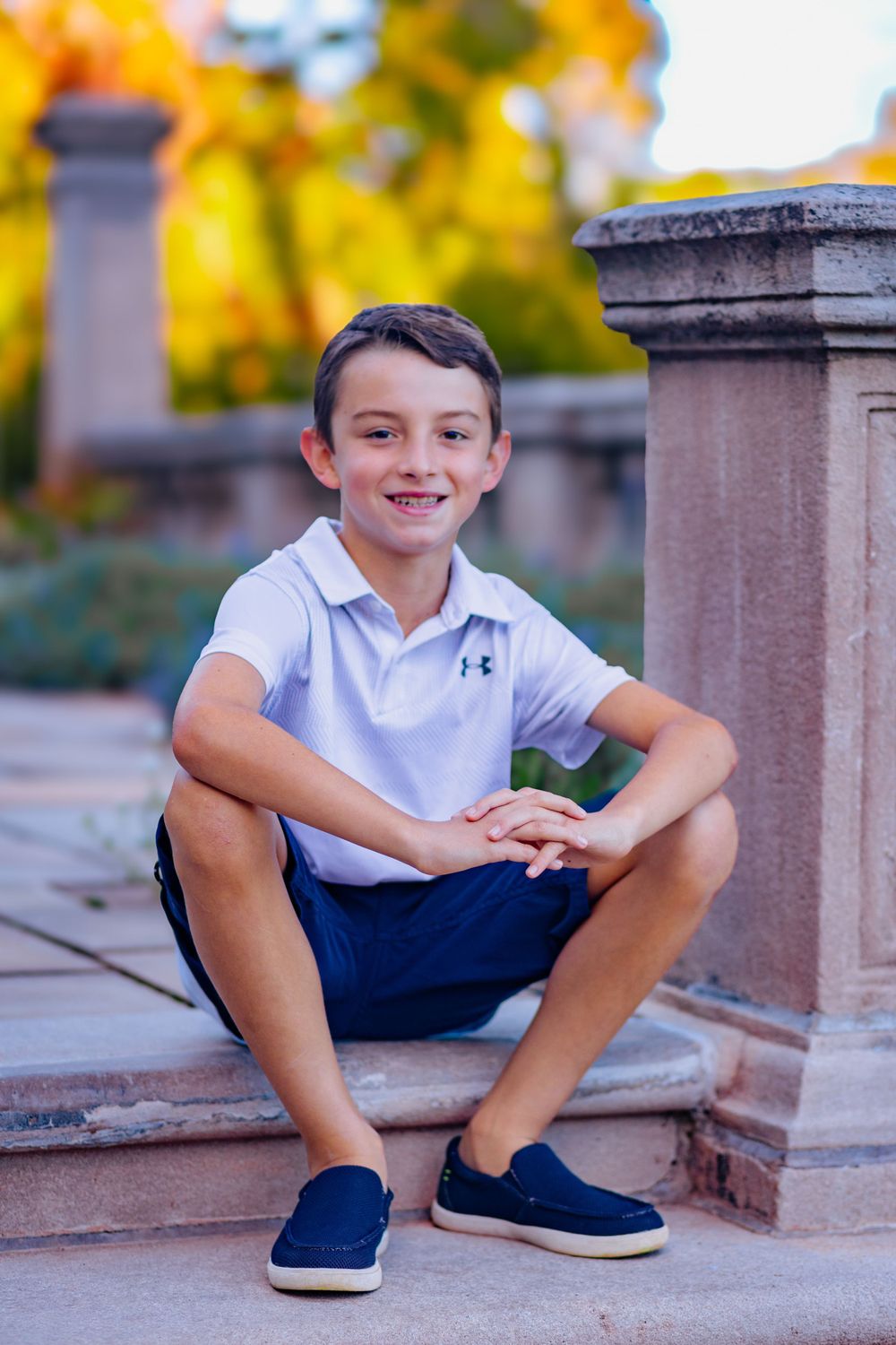 a young boy poses