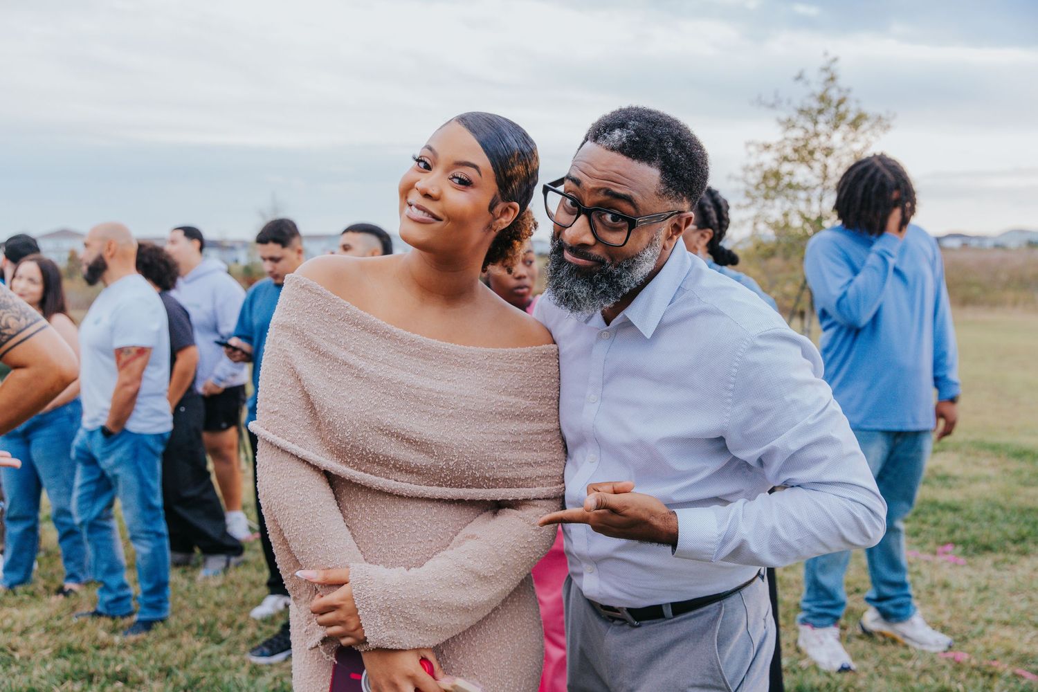 Wedding guests enjoying a lively outdoor celebration with casual attire.