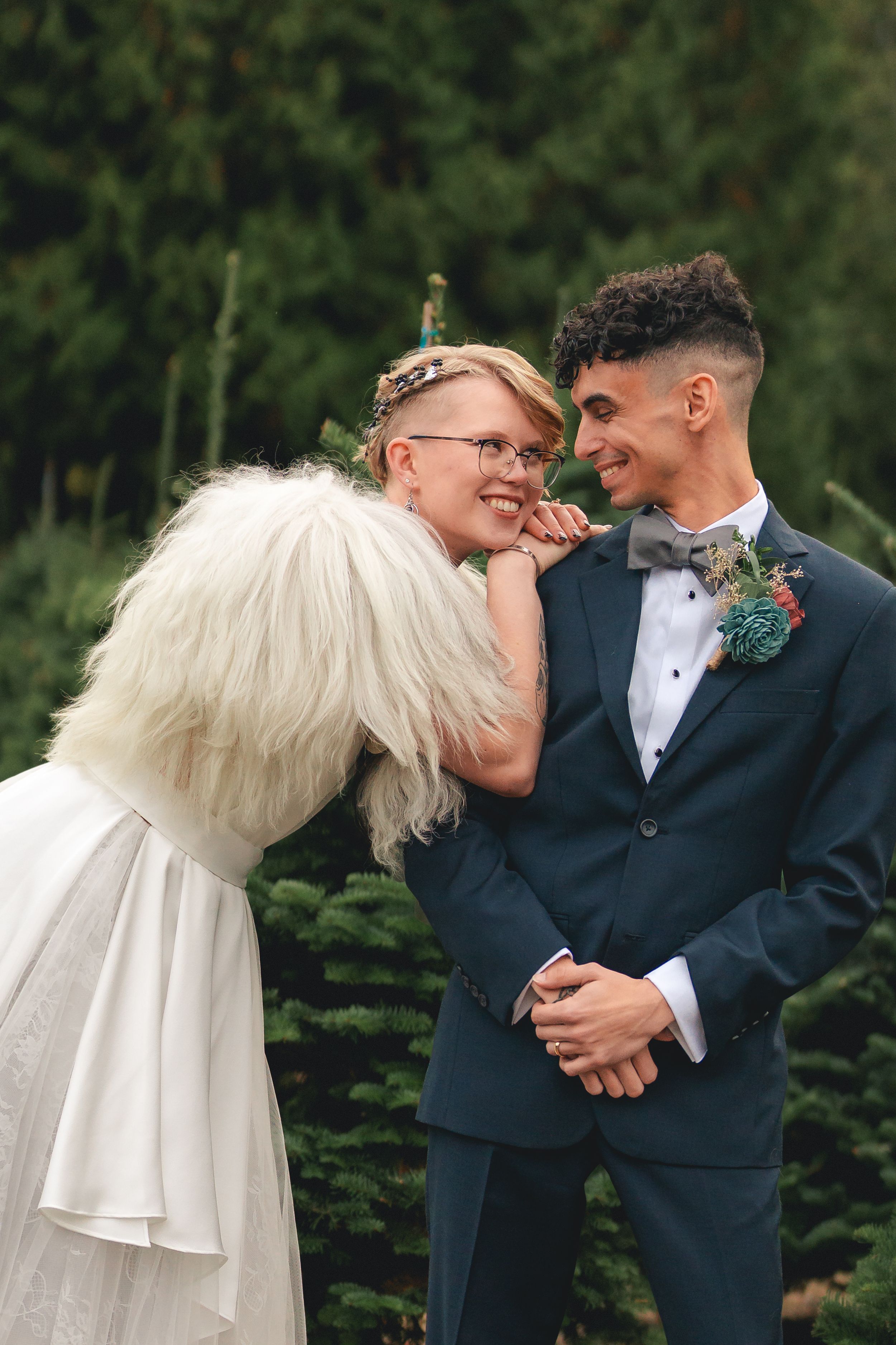 A sequence of wedding photos showing tender moments between a couple in formal attire against a green outdoor backdrop.