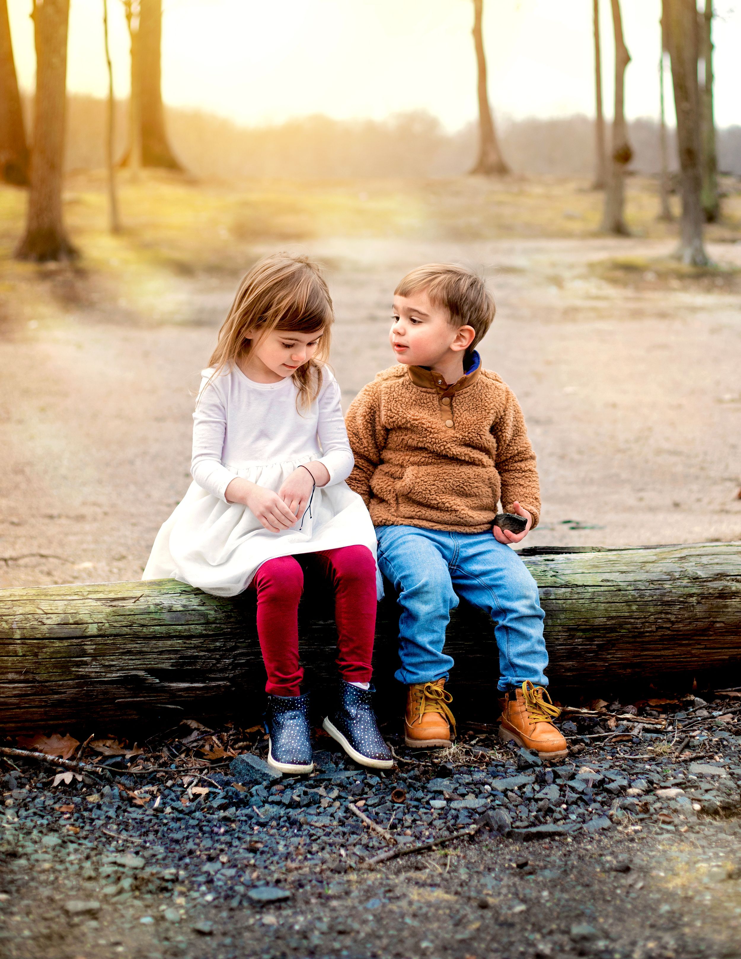Best Bergen County Family Photographer - brother and sister at park in Ridgewood, NJ.  Brother looking lovingly at sister.