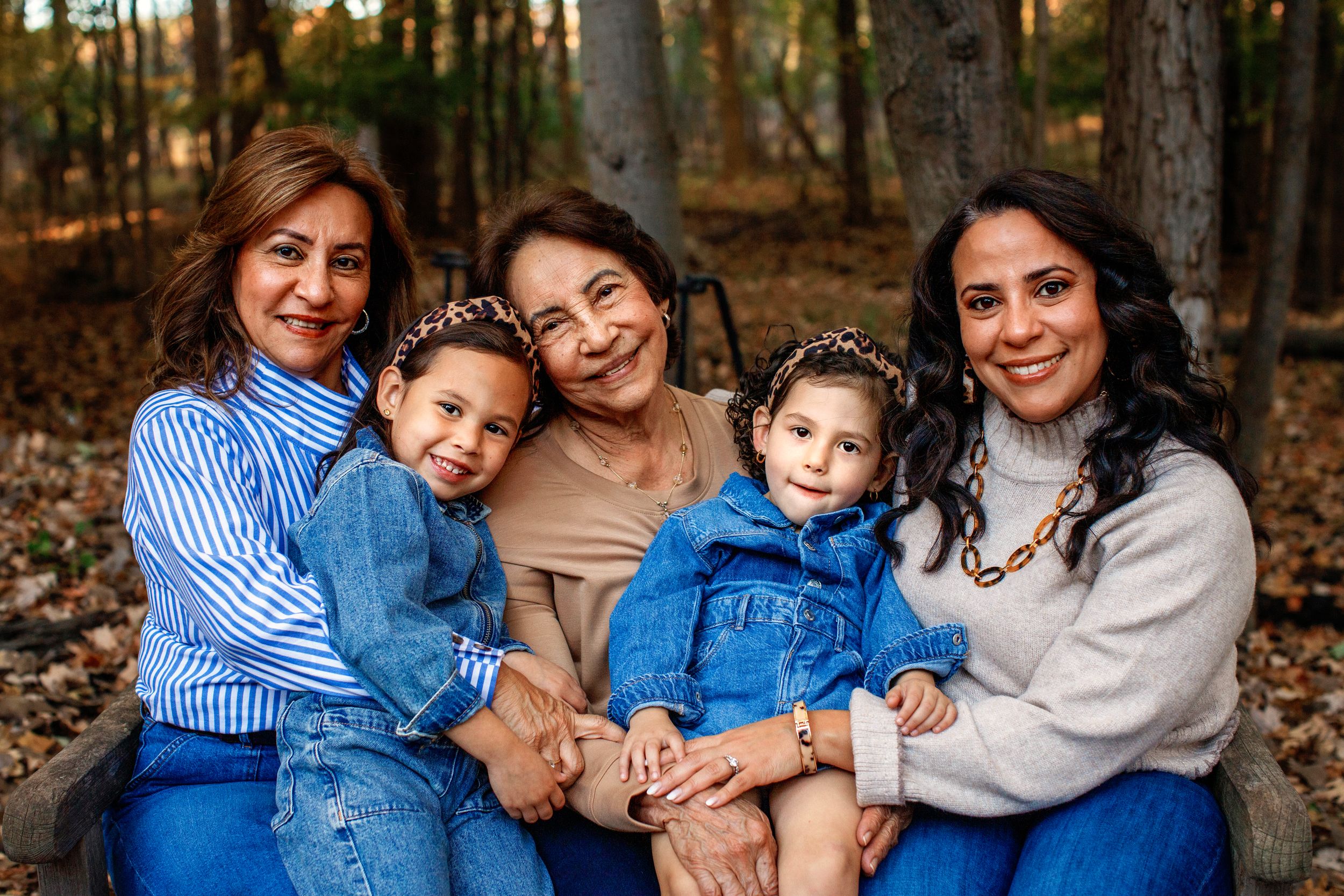 Bergen County family photographer capturing 4 generations near Allendale, New Jersey.  Grandma is the center of attention in this photo.