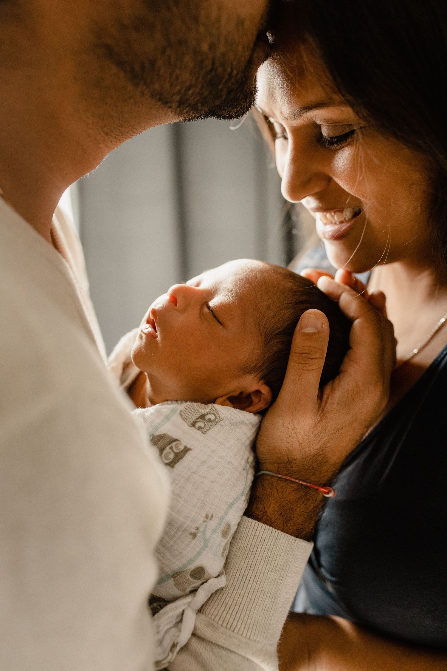 Intimate close-up lifestyle photos of tender newborn baby moments.