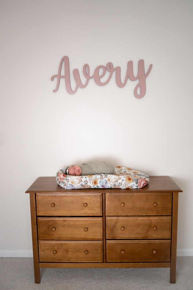 Newborn baby on her changing table