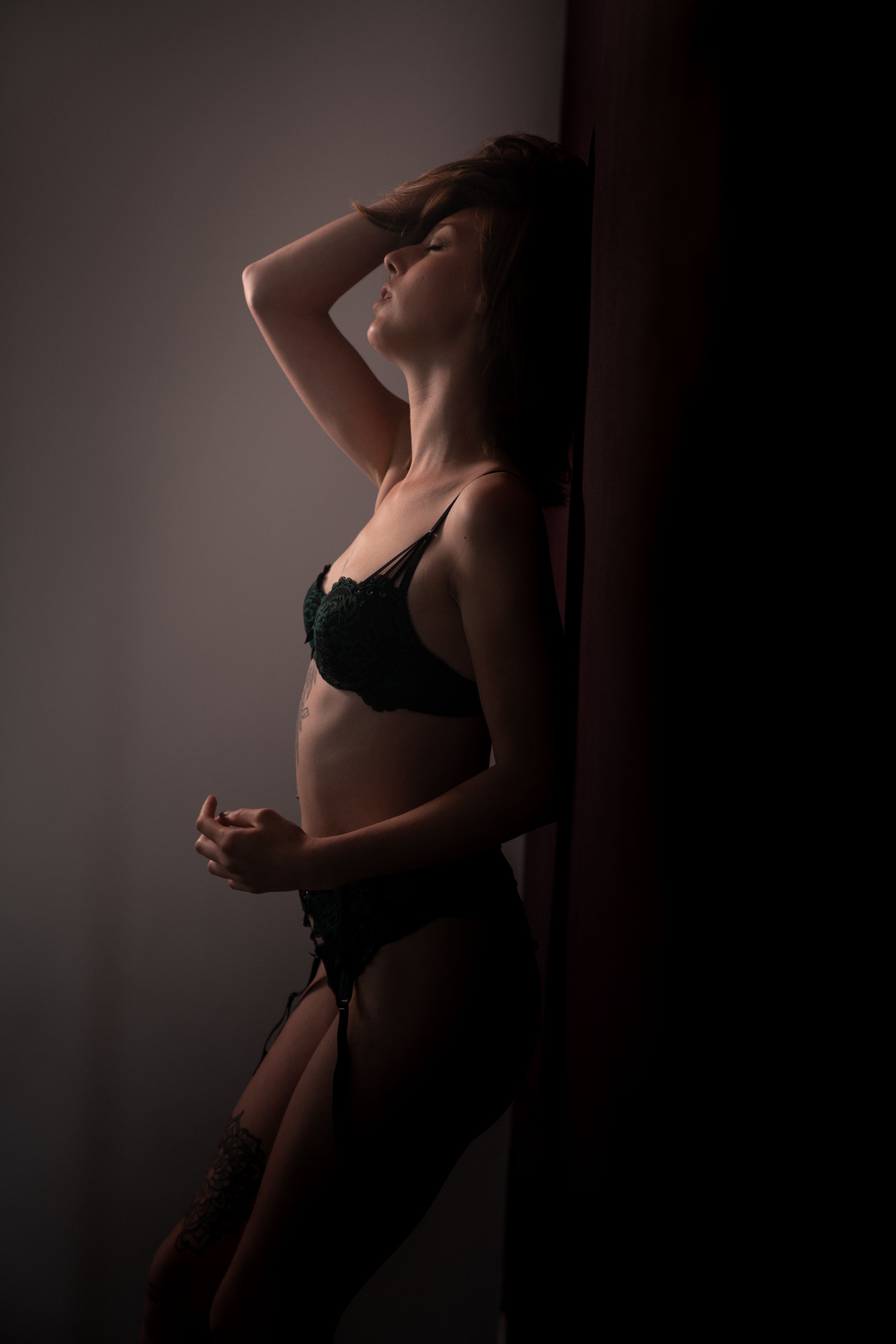 a photo of a sexy woman during a sexy photo shoot, also called a boudoir photo shoot, in which she expresses selflove