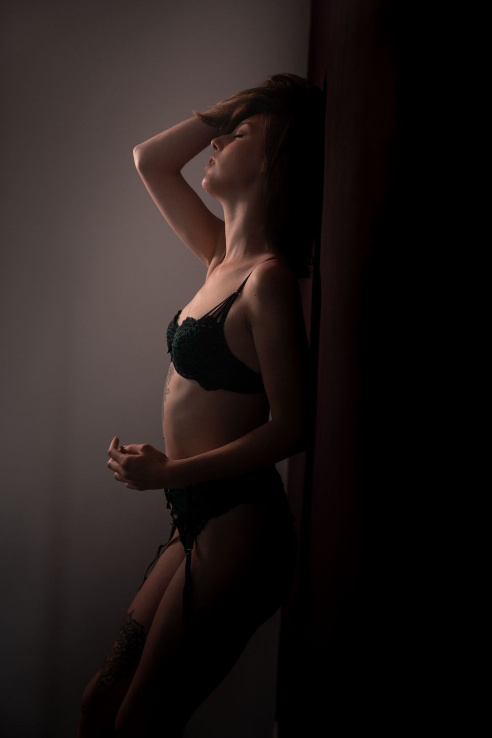 a photo of a sexy woman during a sexy photo shoot, also called a boudoir photo shoot, in which she expresses selflove