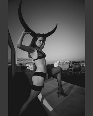 a photo of a sexy woman during a sexy photo shoot, also called a boudoir photo shoot, in which she expresses selflove