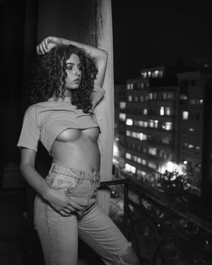 a photo of a sexy woman during a sexy photo shoot, also called a boudoir photo shoot, in which she expresses selflove