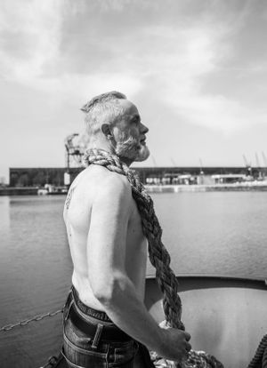 a photo of a sexy men during a sexy photo shoot, also called a boudoir photo shoot, in which she expresses selflove
