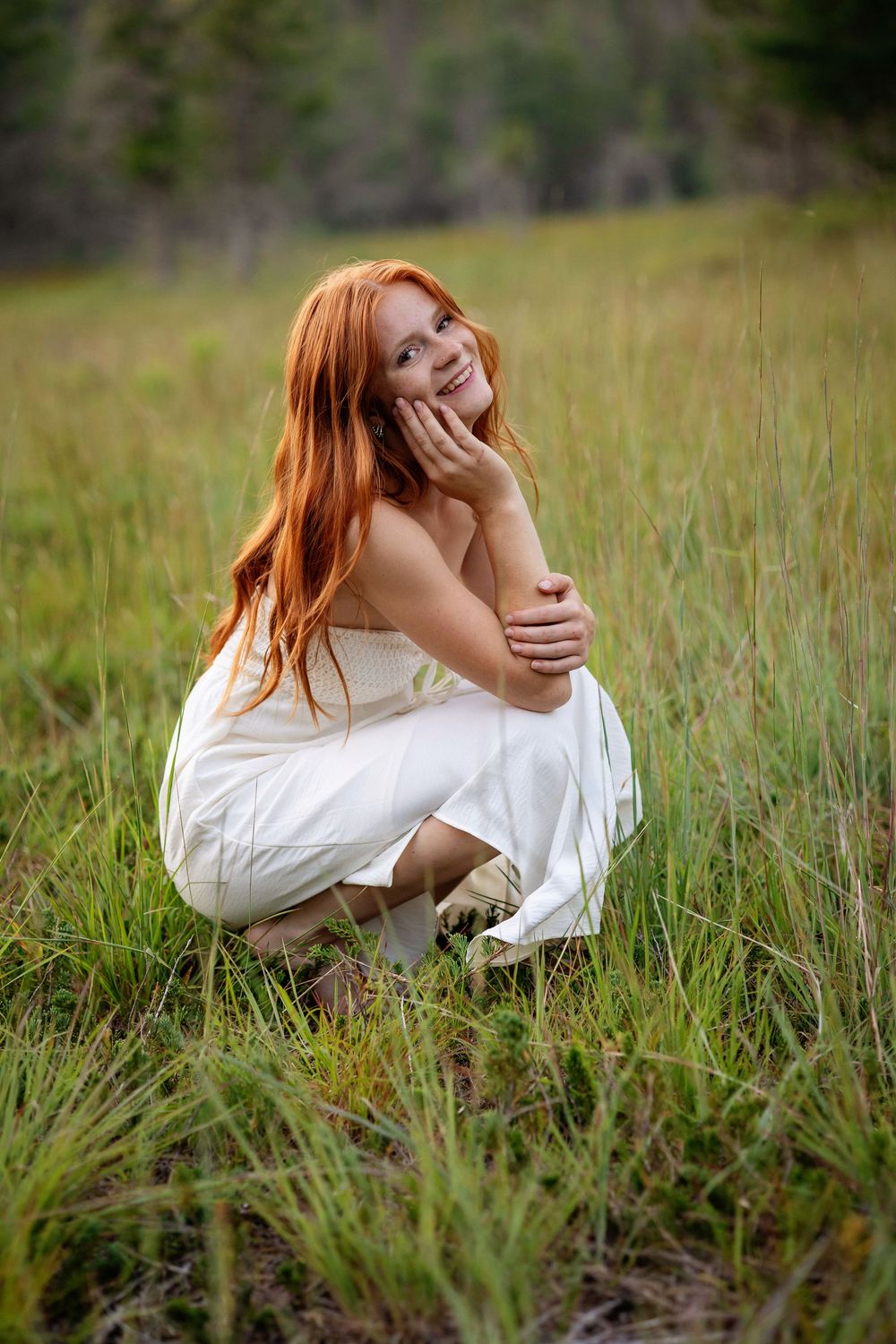 A joyful moment captured in a field of tall grass during golden hour.