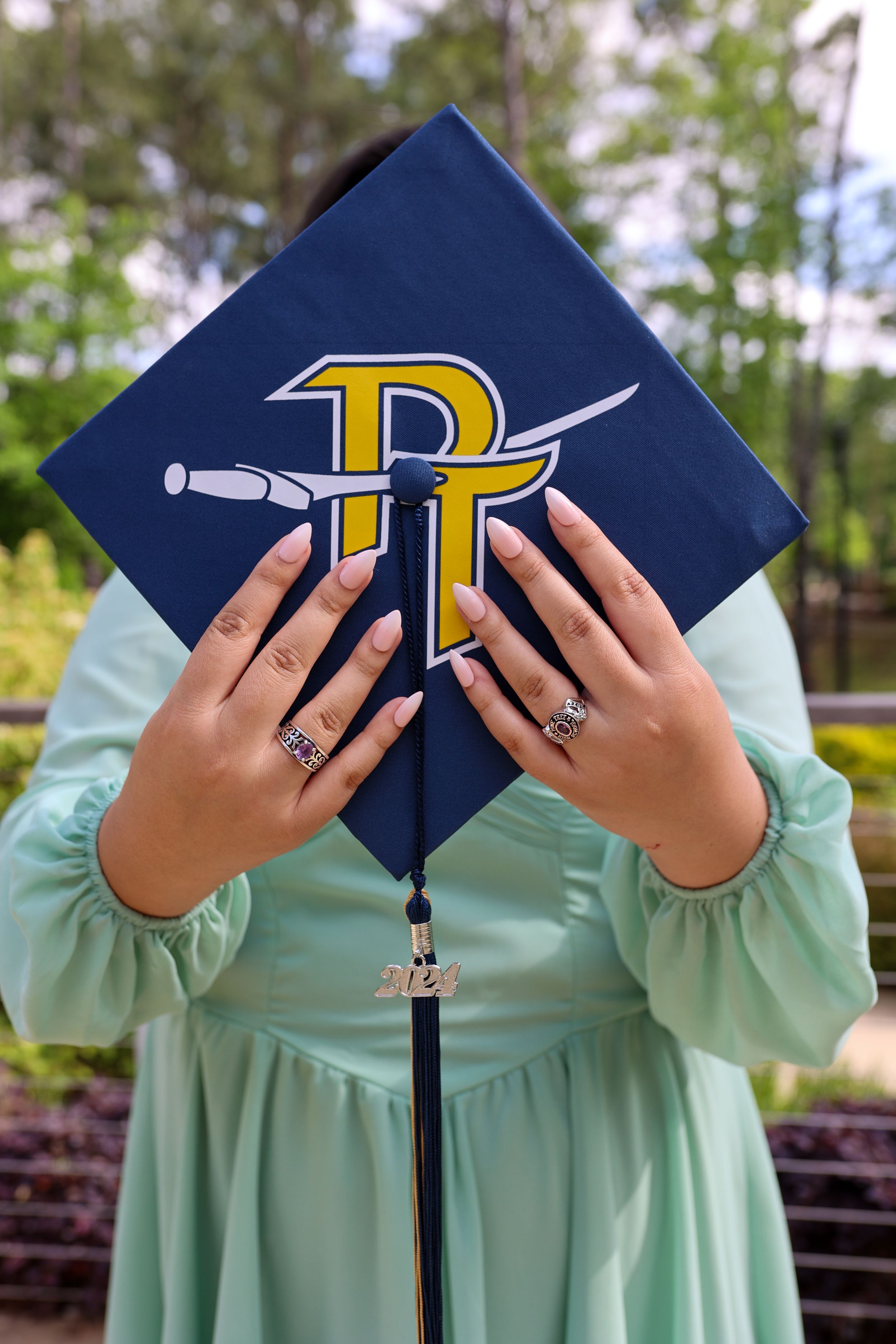 woman holding graduation cap