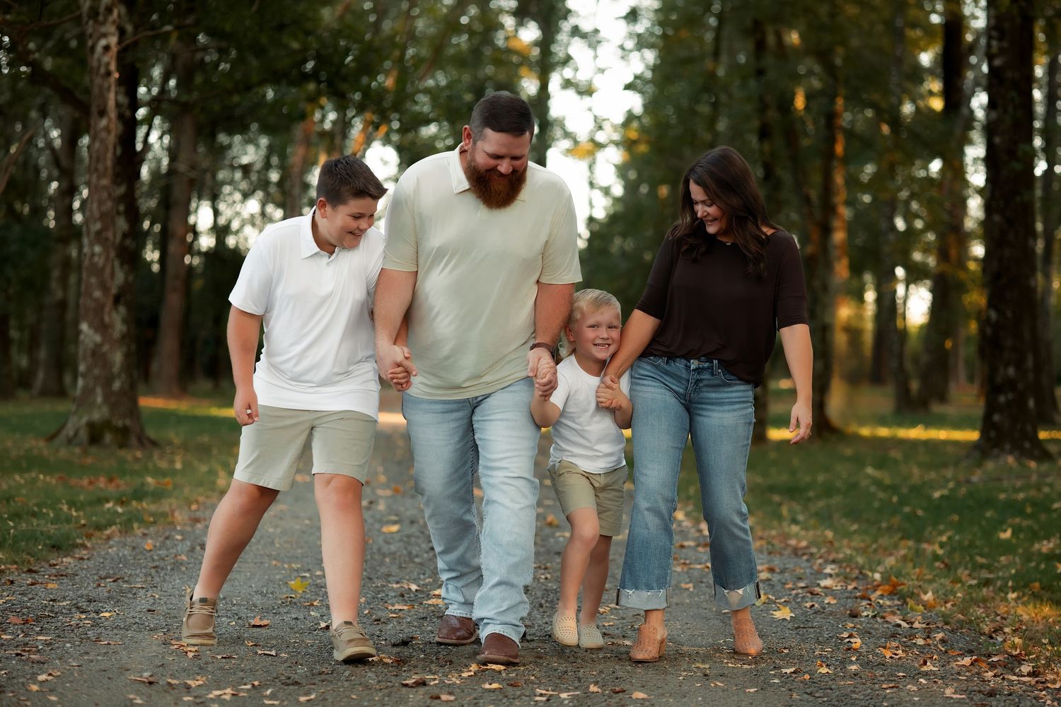 Cabot Arkansas Family pictures in Jacksonville, Arkansas- family walking along a path playing a game