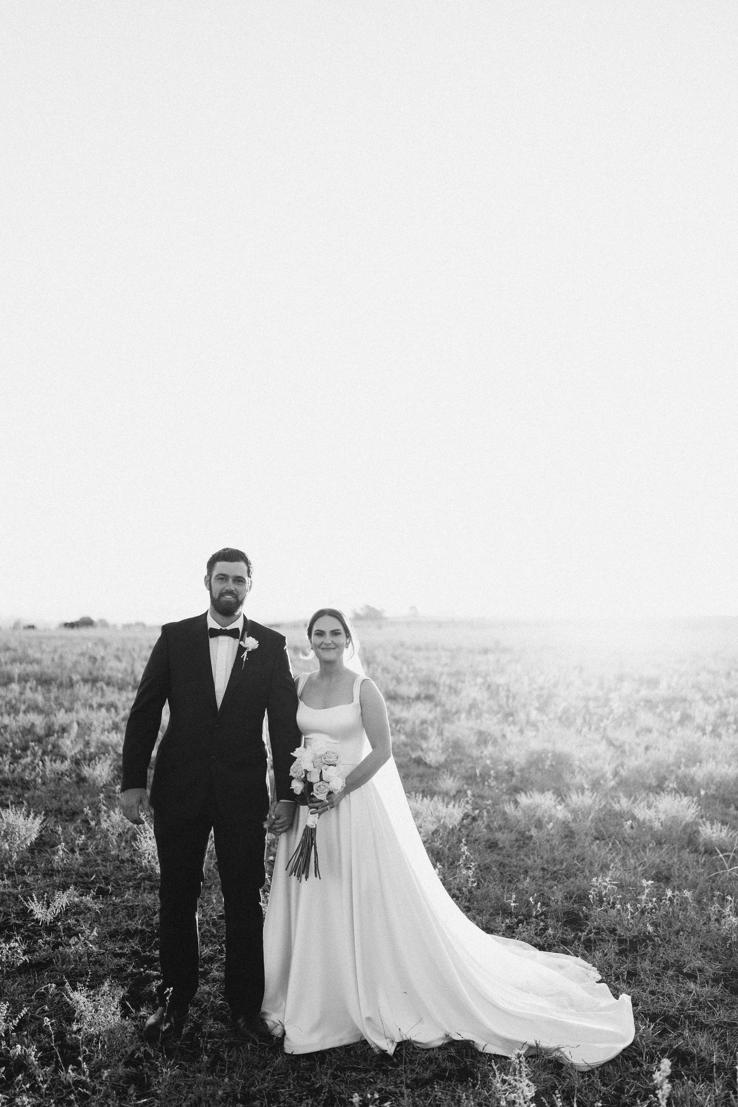 bride and bride embracing