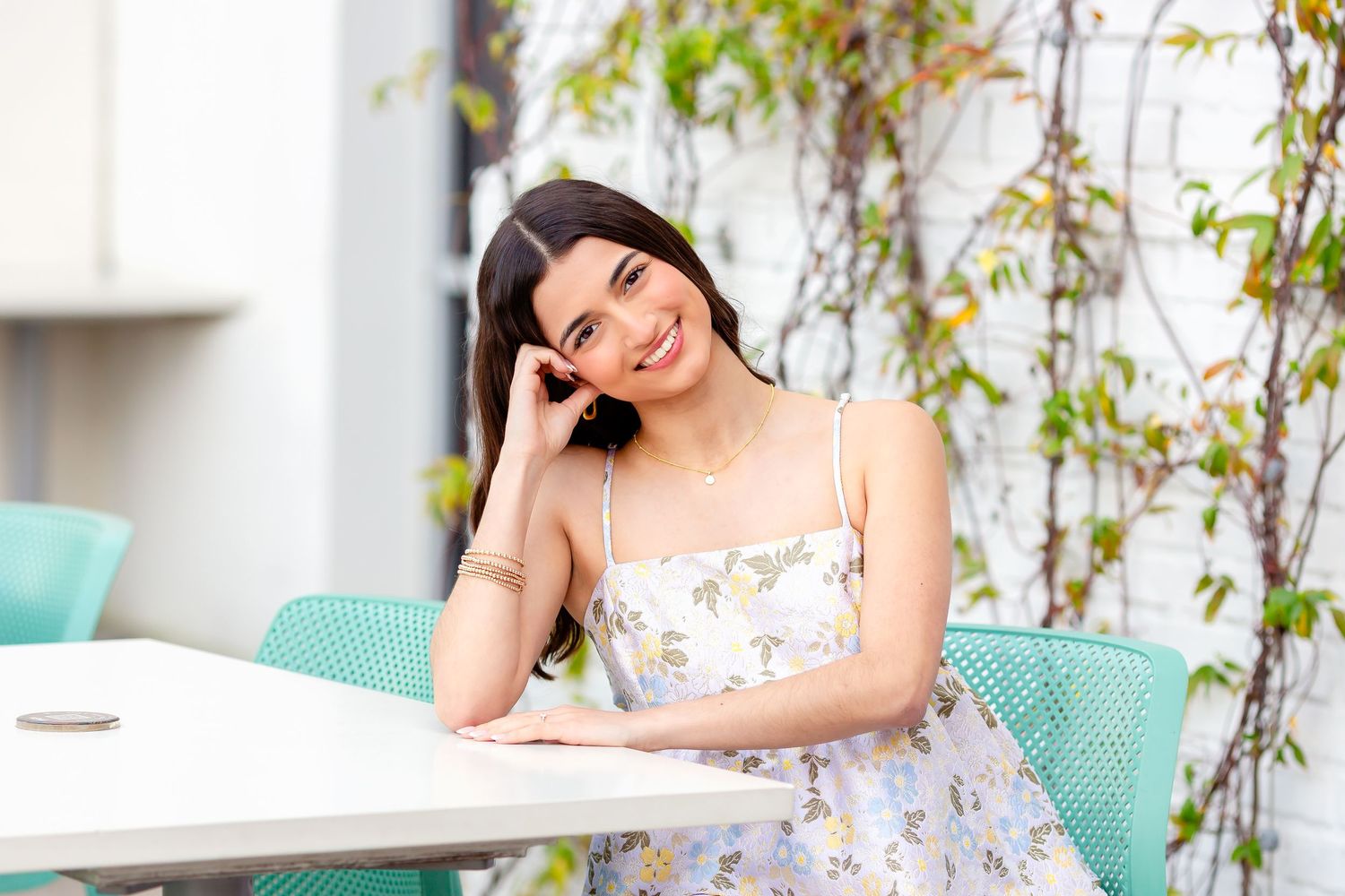 Senior shows off cute outfit during her senior session in downtown Houston, TX.