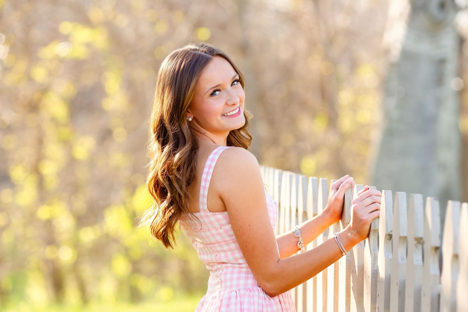 Senior shows off cute outfit during her senior session in downtown Houston, TX.
