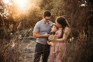 Sunset family photo session in the Branson Ozarks with warm, glowing natural light.