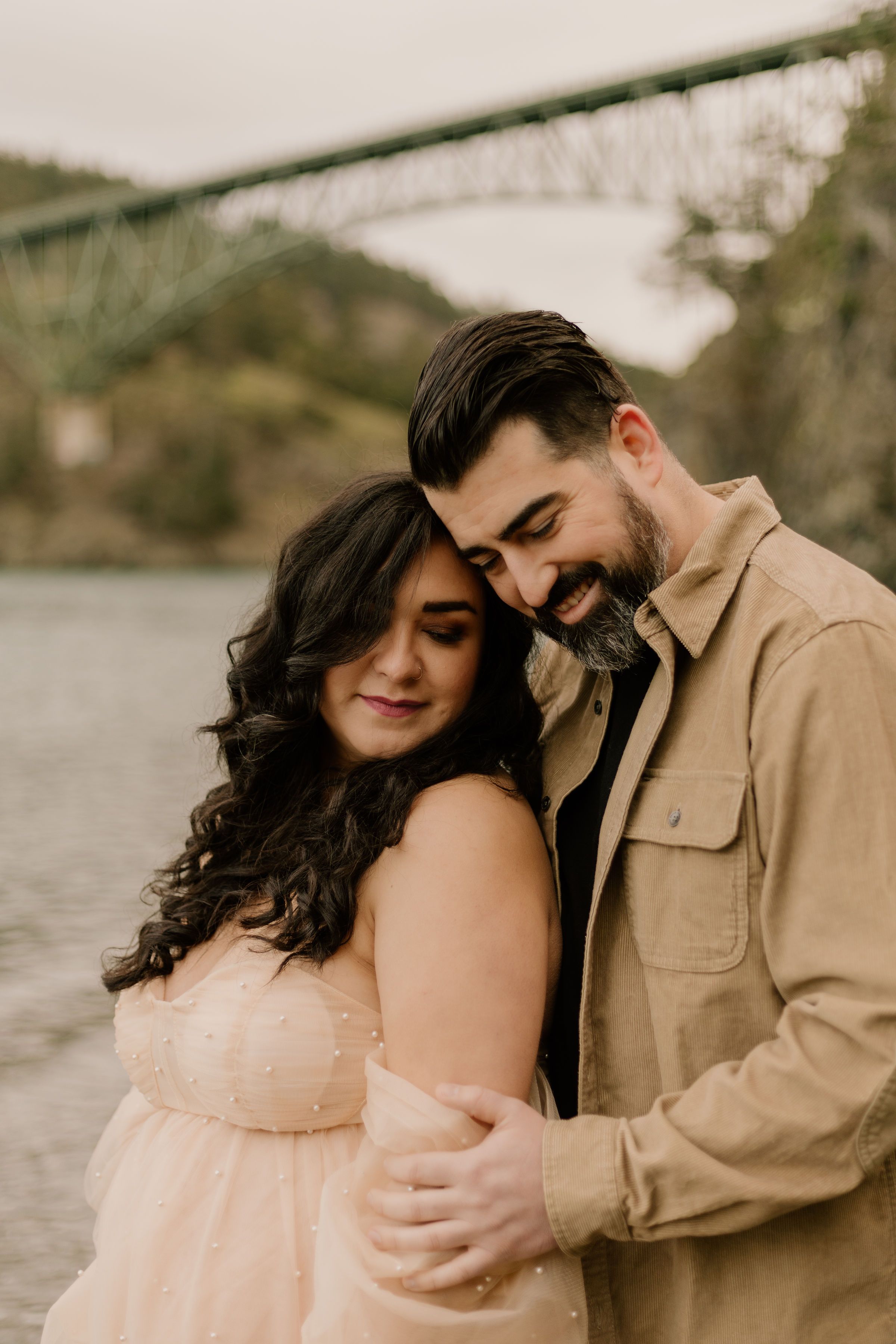 A romantic couple in soft warm tones embraces by a lake, with the frames showing progressive moments of tenderness.