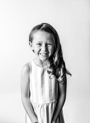 A laughing girl in black and white